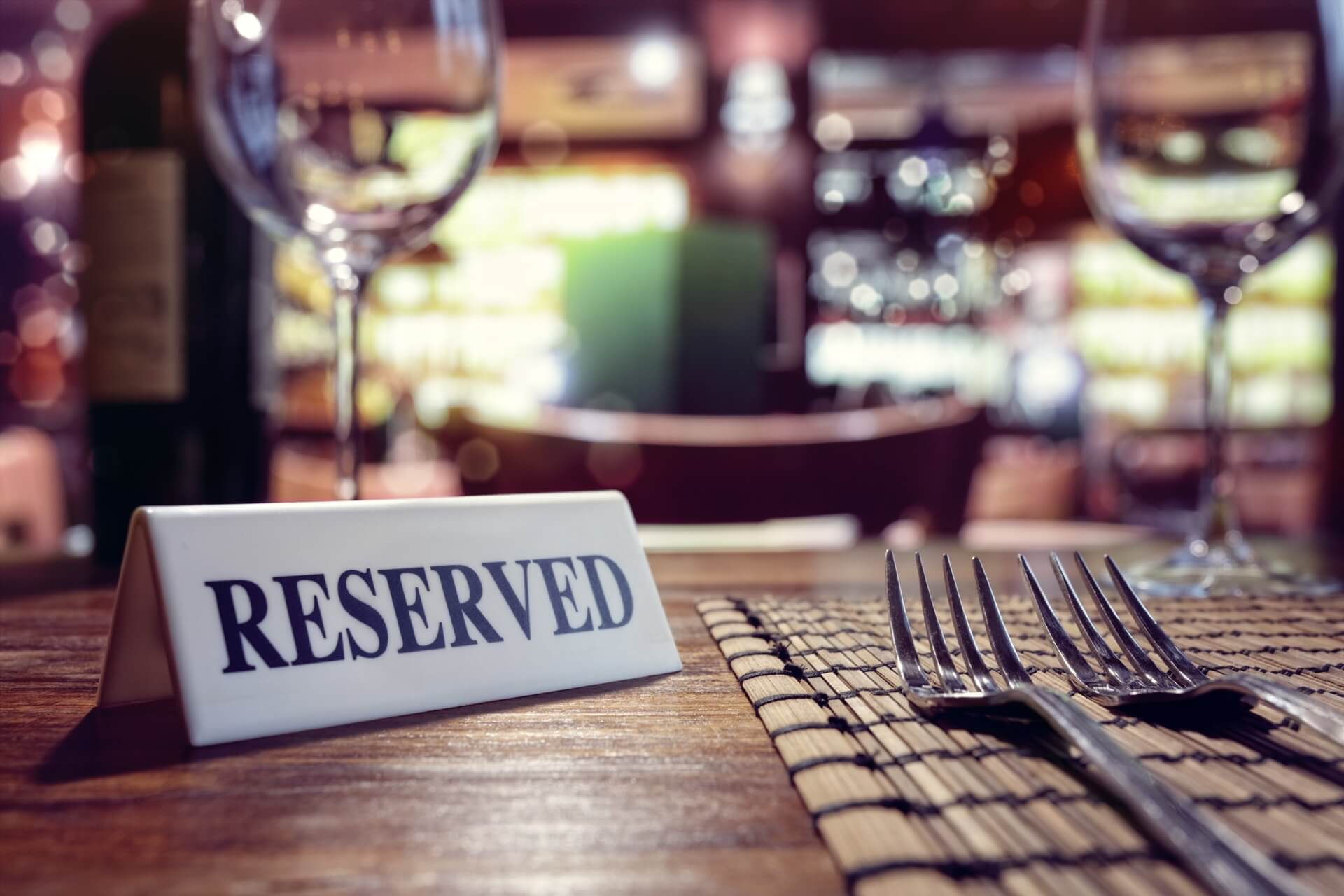 Photo with reserved sign on a table