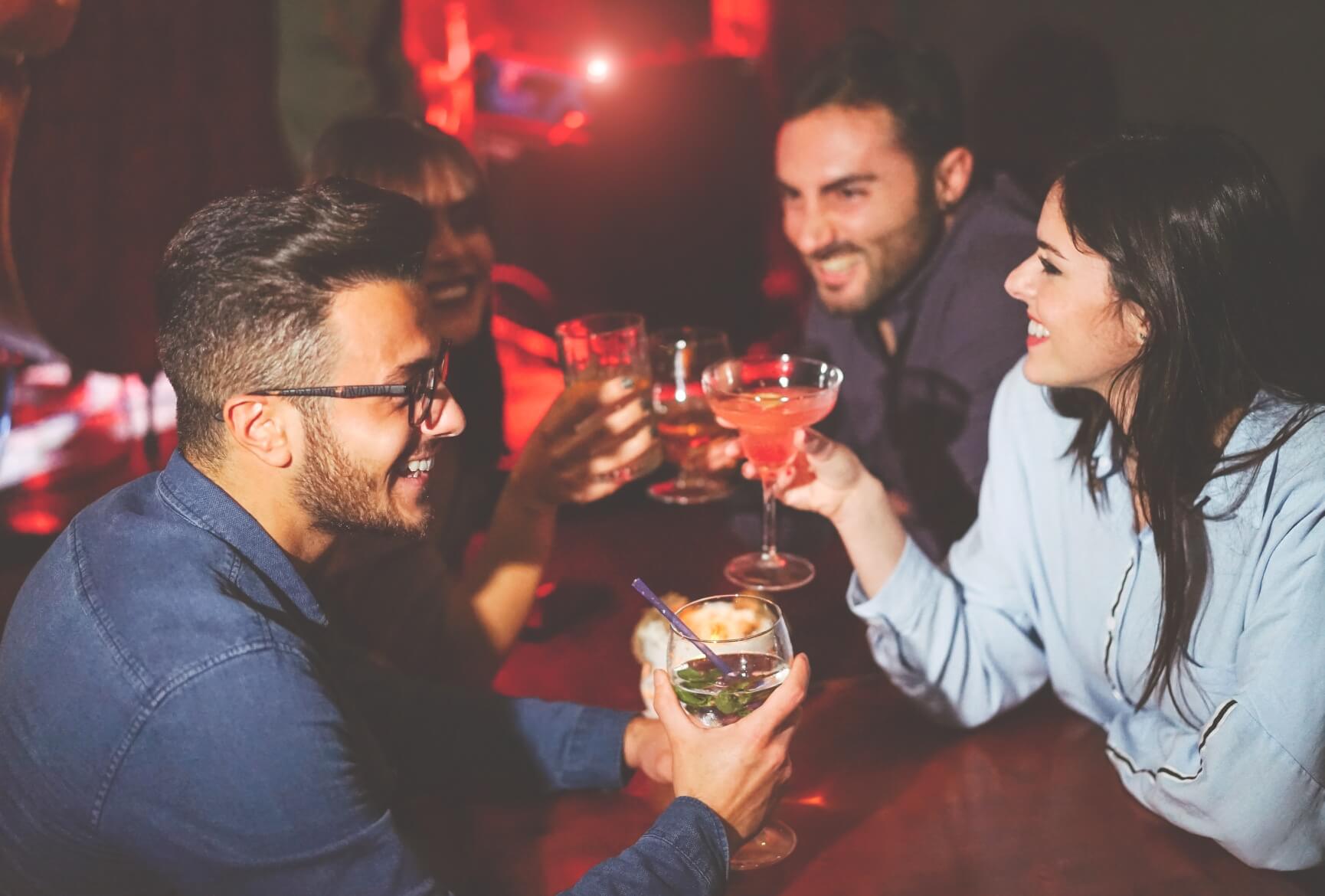 Photo with people enjoying their drinks in a club